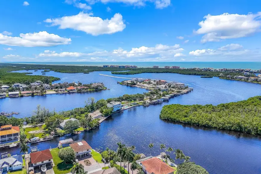 Aerial view of Bonita Springs canals, waterfront homes and the Gulf of Mexico