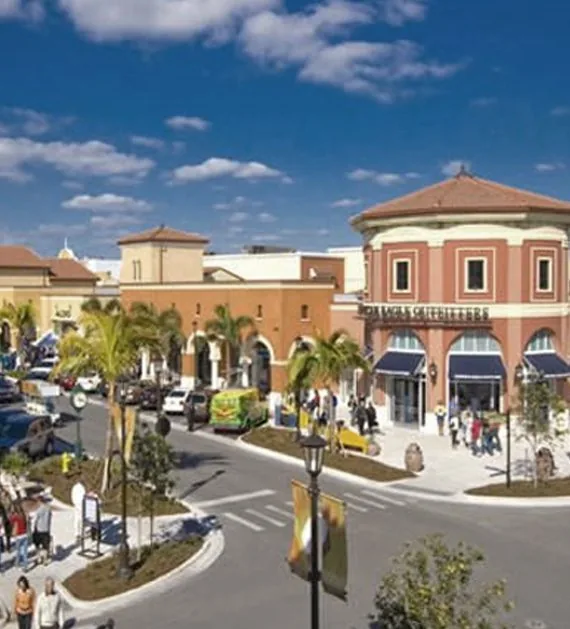 Coconut Point shopping center in Estero with palm trees and Mediterranean storefronts
