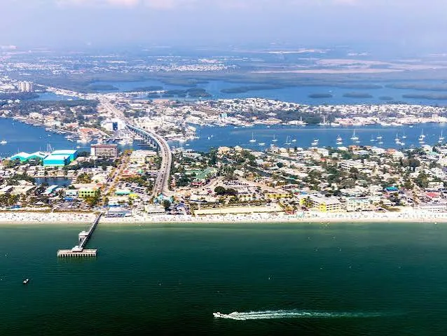 Aerial view of Fort Myers Beach pier, Times Square and Matanzas Pass bridge